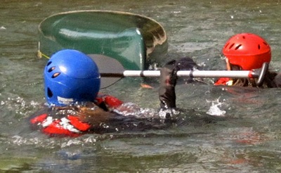 Swimming a Capsized Canoe